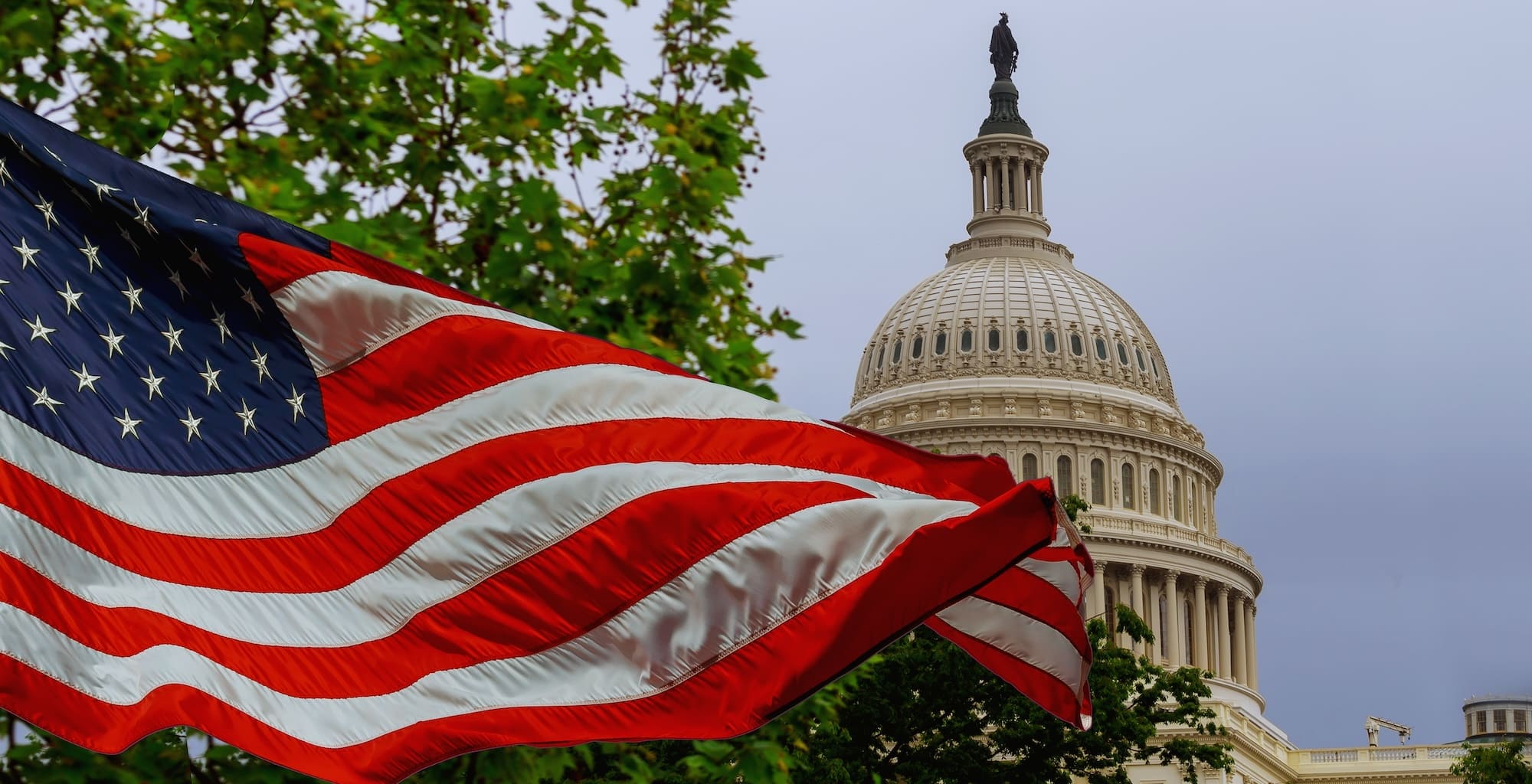 United States Capitol with the American flag in the foreground