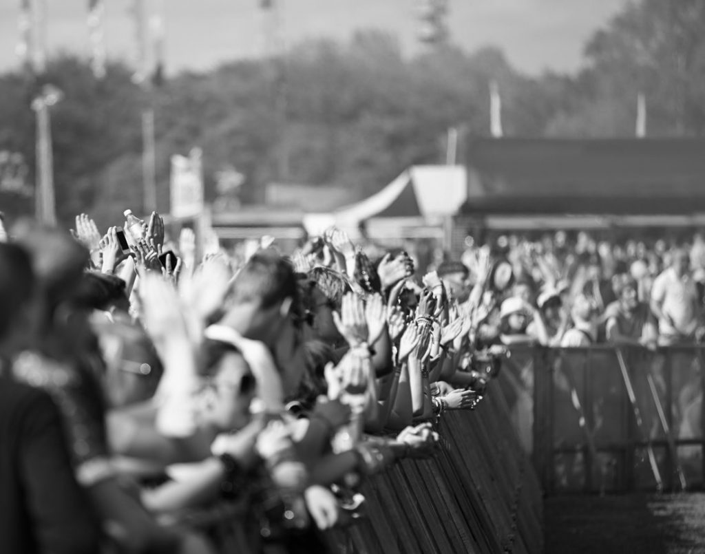 Front-of-stage barricade line at an outdoor music festival